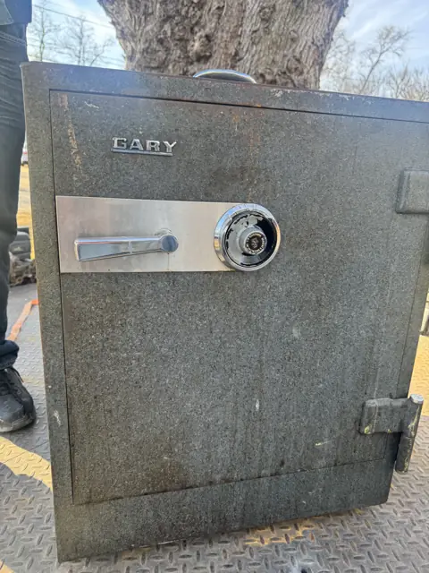 Cary dial combination safe being worked on outdoors