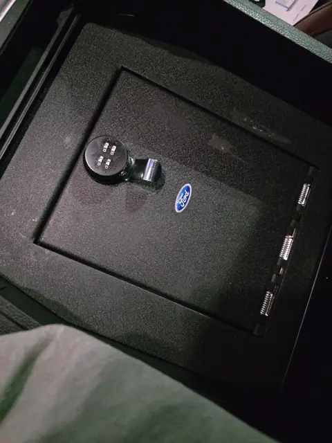 Vehicle center console safe with a combination lock